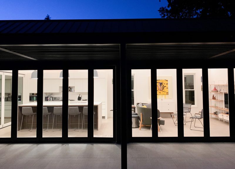 Glass pavilion glowing at night